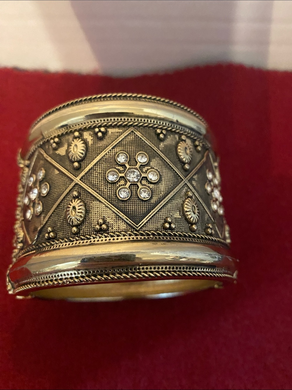 Ornate Gold-Tone hinged Cuff bracelet.